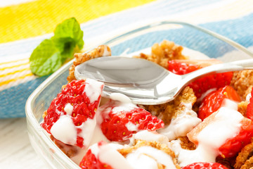 Strawberry pieces with cereals and yogurt