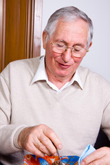 elderly man at table