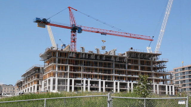 Crane swings around. Construction in Toronto.