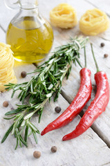 Italian ingredients - rosemary, olive oil, chilli, tagliolini