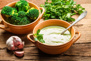 Soup made of fresh broccoli, garlic and parsley