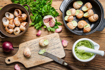 Filling snails with garlic butter