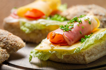 Closeup of Fesh sandwich made of chive, ham lettuce and cheese