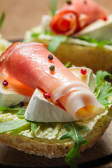Closeup of fresh sandwich with parma ham