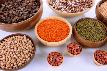Different kinds of beans in bowls close-up