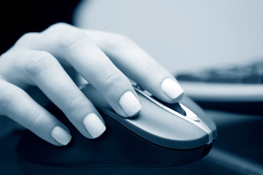 Female Hand Holding Computer Mouse