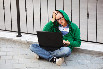 Young student using laptop