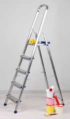 Metal ladder and paint in room