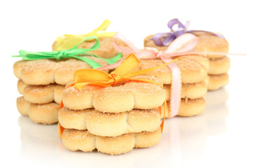 Sweet cookies tied with colorful ribbons isolated on white