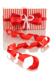 Present box with ribbon curl isolated on white