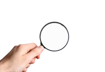 Hand holding a black magnifying glass isolated on white