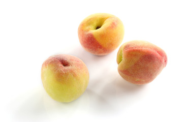 Ripe peach fruit on white background