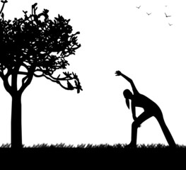 Girl exercising in spring outdoors in park silhouette