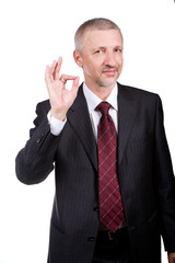 Businessman showing OK gesture