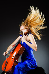 Attractive woman with cello in studio © Elnur