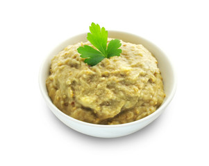 Aubergine paste in a bowl on white background