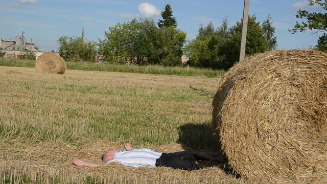 man run strike crash fall down round straw bale