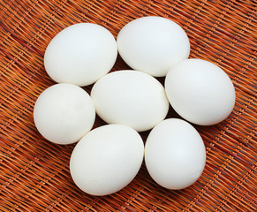 White eggs in a wicker basket