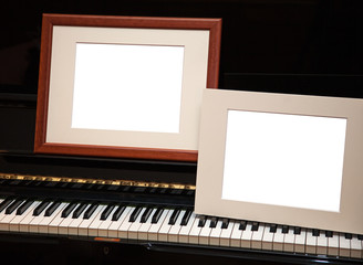 Two empty frames on piano