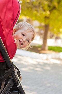 happy baby in a stroller