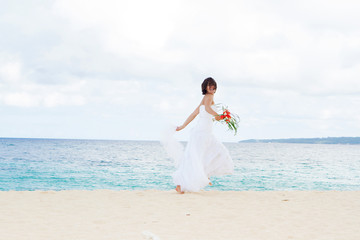 Fototapeta na wymiar outdoor portrait of young beautiful woman bride in wedding dress
