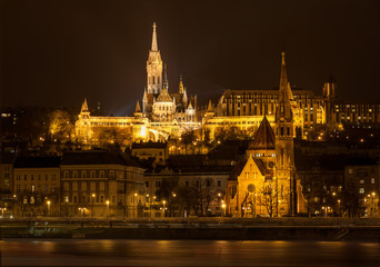 Matthias Church and Protestant church in Budapest at night