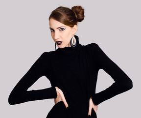 Extravagant fashion model in black posing
