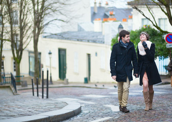 Beautiful young couple walking in Paris