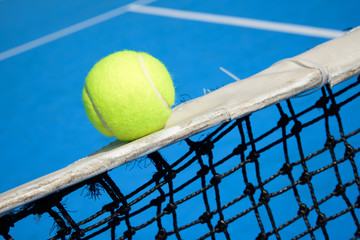 Tennis ball in net