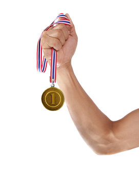 hand and gold medal isolated on white