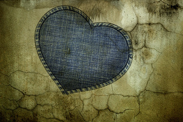 Naklejka na ściany i meble rough heart on cracked wall background