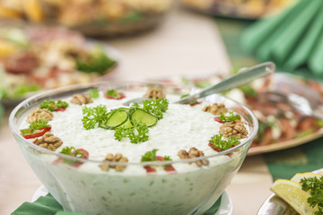 Catering arrangement with creamy salad with a focus on the foreg