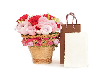 Fototapeta na wymiar Paper flower in a basket with blank old photo frame