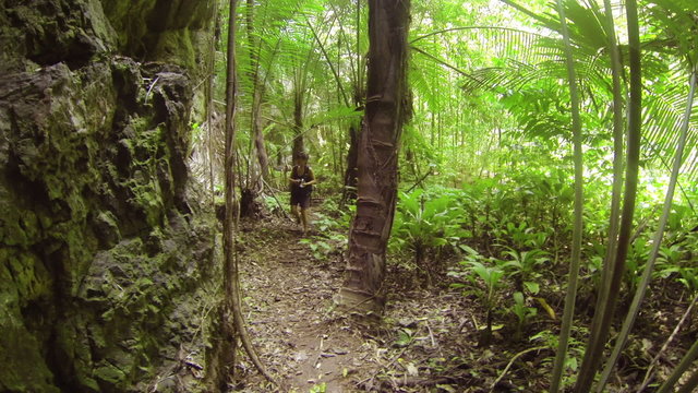1920x1080 video - Tourist woman with camera walking in jungle