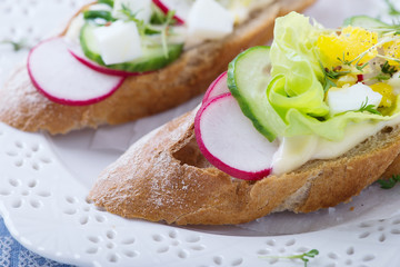 Sandwiches wit egg, lettuce, radish and cucumber