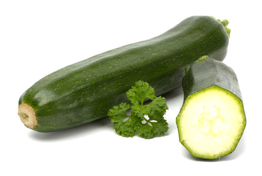 Two fresh vegetable zucchini isolated on white background