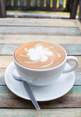 Hot coffee lattee on grunge background