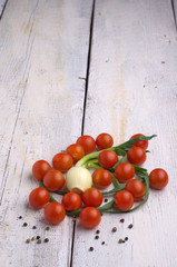 Fresh sweet tomato on the wooden table