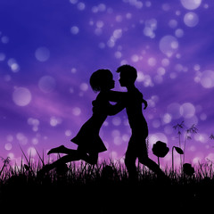 Obraz na płótnie Canvas Couple silhouette on grass field