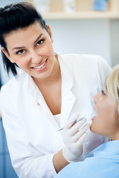 Smiling woman dentist