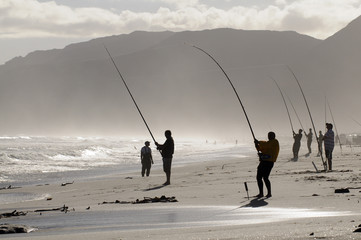 Men fishing from the beach South Africa