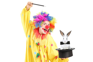 A circus clown performing a magic trick with a top hat and a rab