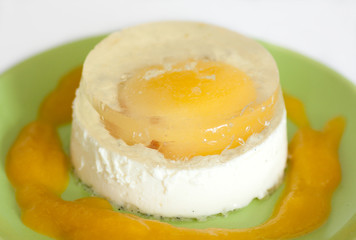italian panna cotta dessert with apricot sauce and jelly