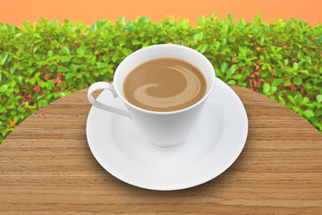 cup of coffee on wooden table