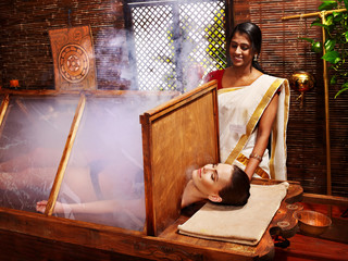 Woman having Ayurveda sauna.