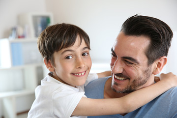 Portrait of father and son relaxing at home