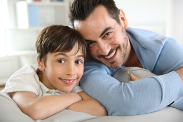 Portrait of father and son relaxing at home