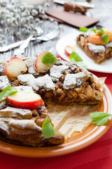 large cake out of short pastry and apples