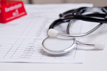 black stethoscope on a medical analysis