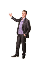 Happy young friendly smiling businessman pointing finger
